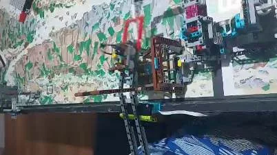 Robot attachment being tested on the Unearthed competition mat