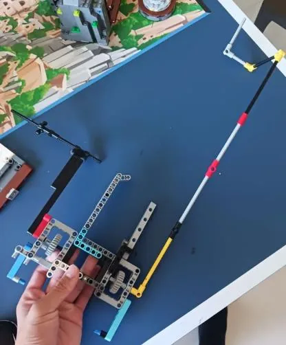 Attachment four mounted on the robot over the competition mat