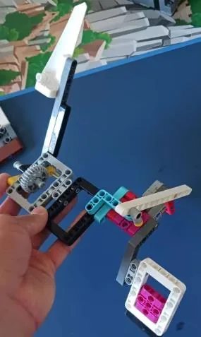 Attachment five held above the competition mat